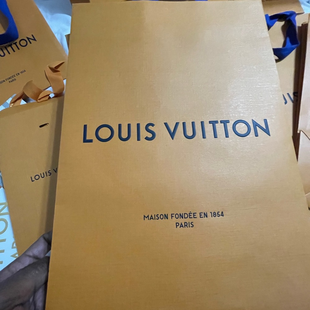 Louis Vuitton empty shopping bags and boxes.